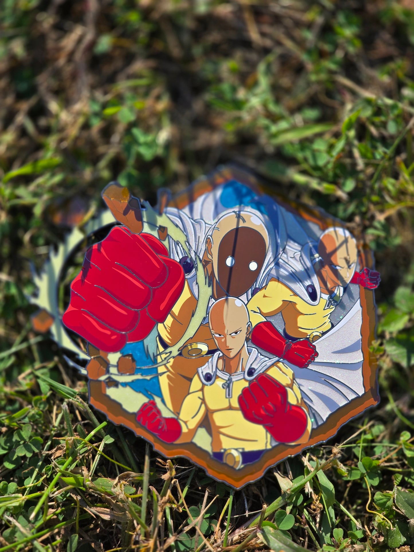 Mega punch enamel pin in hand